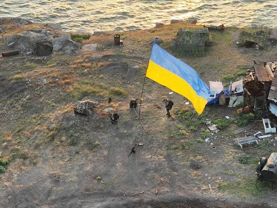 Ukrainian service members install national flag on Snake (Zmiinyi) Island