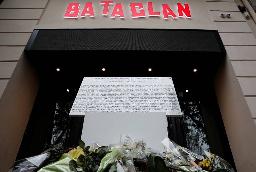 FILE PHOTO: A commemorative plaque unveiled by French President Francois Hollande and Paris Mayor Anne Hidalgo is seen in front of the Bataclan concert hall