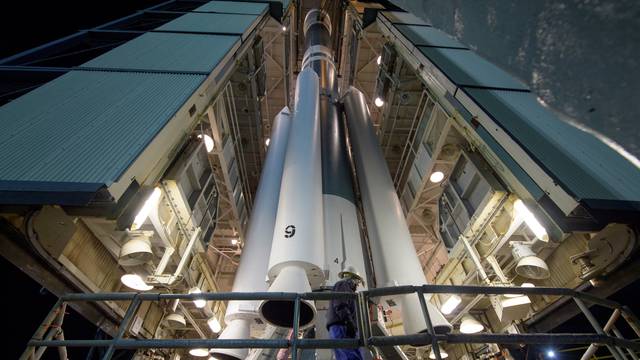 Workers prepare the United Launch Alliance Delta II rocket, with the NASA Ice, Cloud and land Elevation Satellite-2 (ICESat-2) onboard