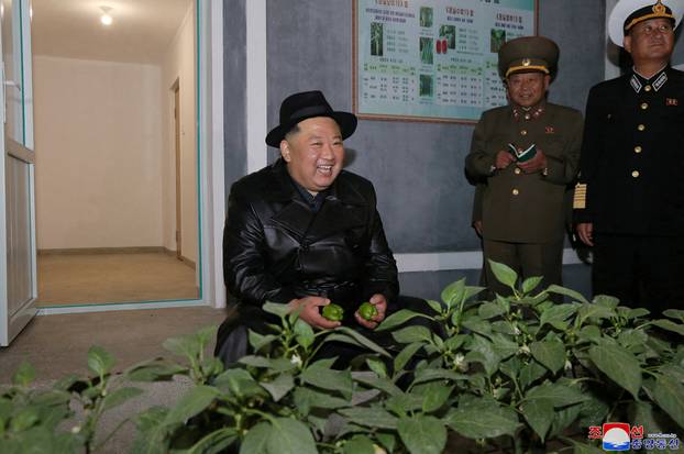 North Korea's leader Kim Jong Un attends the opening ceremony of the Ryonpho Greenhouse Farm