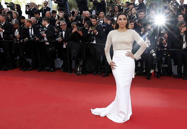 Actress Eva Longoria poses on the red carpet as she arrives for the opening ceremony and the screening of the film "Cafe Society" out of competition during the 69th Cannes Film Festival in Cannes