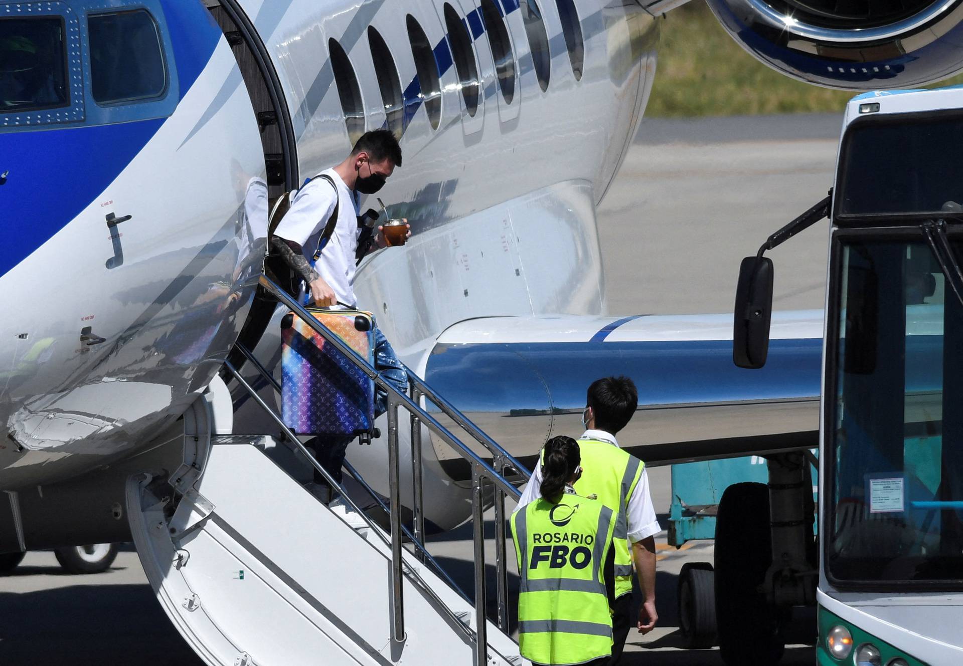 Argentine footballer Lionel Messi gets down from a plane on arrival at the Islas Malvinas airport, in Rosario