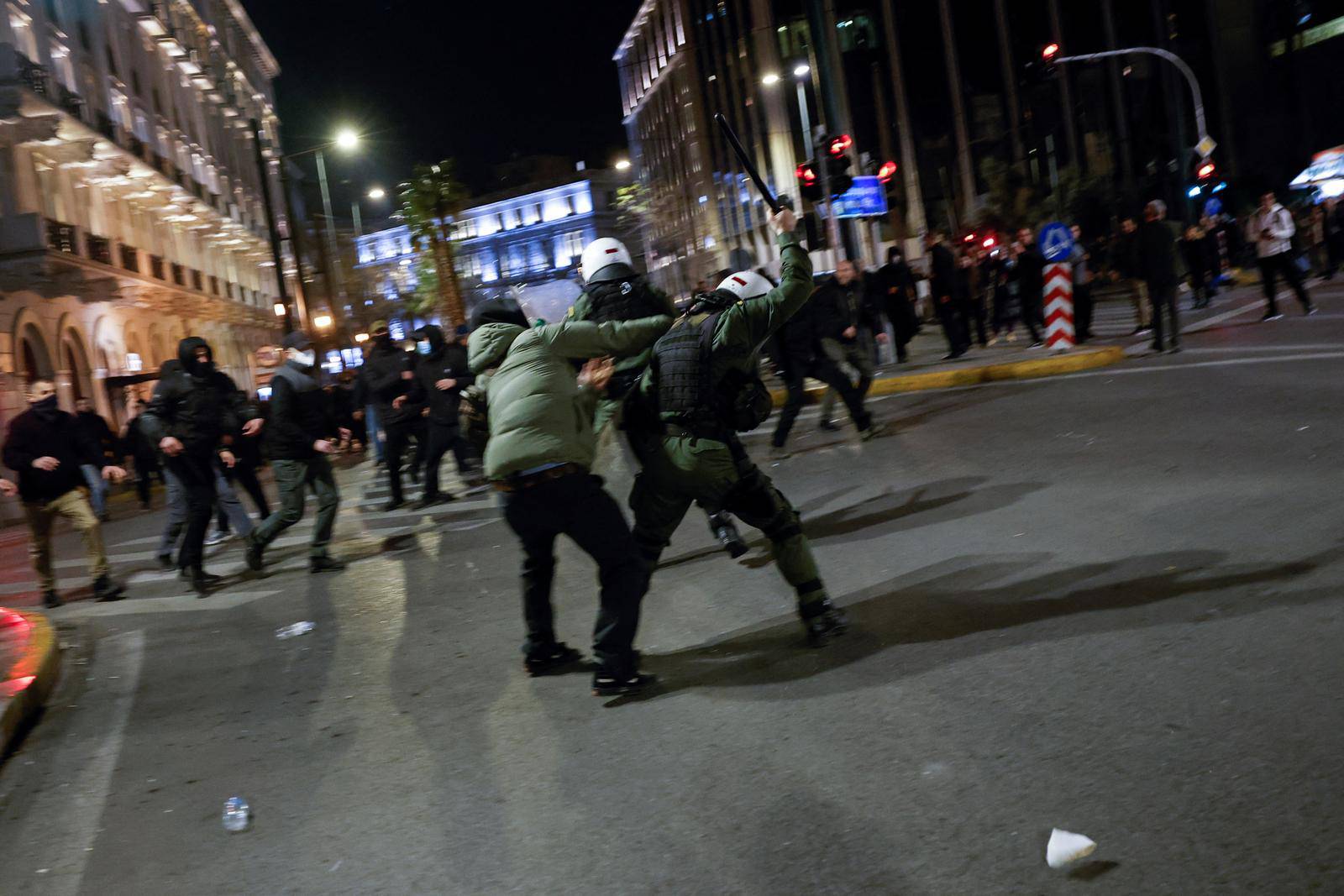 Protesters clash with police during a demonstration after a train crash near the city of Larissa, in Athens