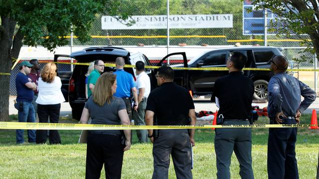 Police investigate the shooting scene after a gunman opened fire on Republican members of Congress during a baseball practice in Alexandria, Virginia