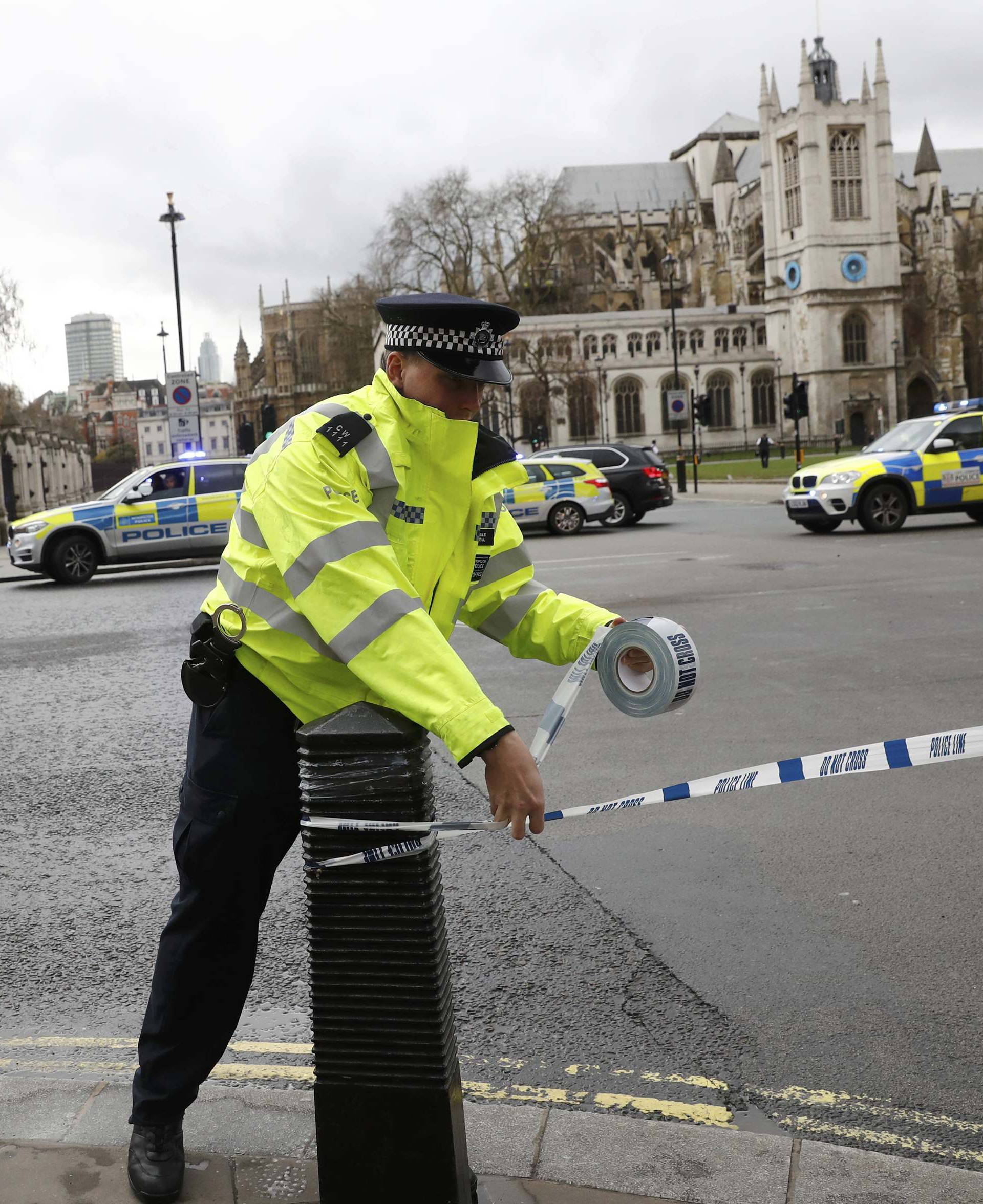 Police tapes off Parliament Square after reports of loud bangs, in London