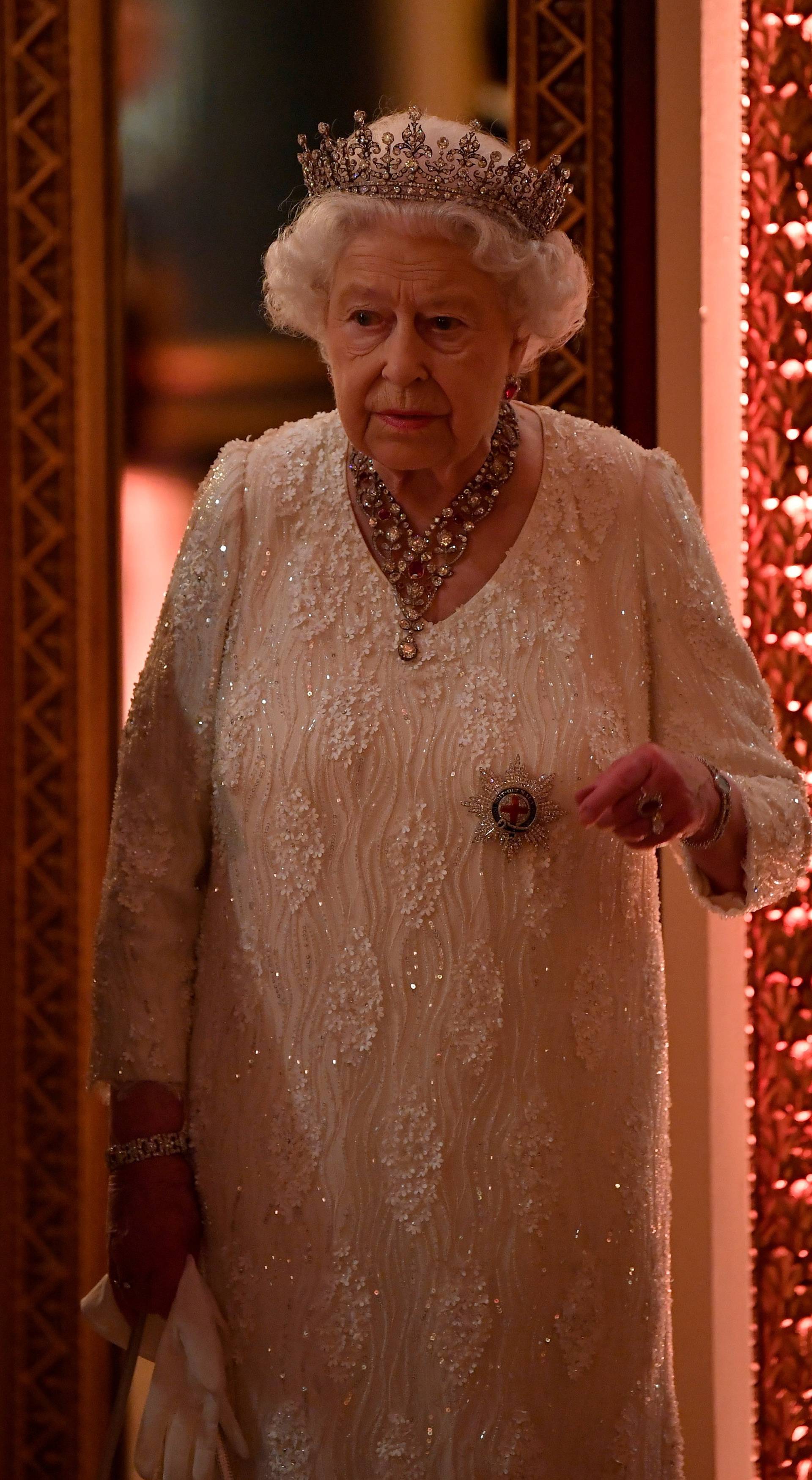 Britain's Queen Elizabeth arrives to The Queen's Dinner during the Commonwealth Heads of Government Meeting at Buckingham Palace in London, Britain