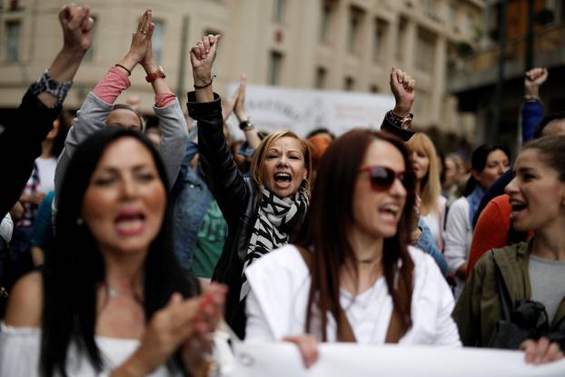 Demonstrators shouts slogans during a demonstration marking a 24-hour general strike against the latest round of austerity in Athens