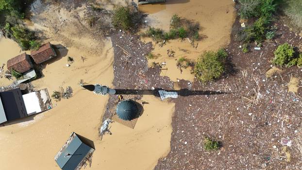 A drone view shows a flooded residential area and mosque in Donja Jablanica