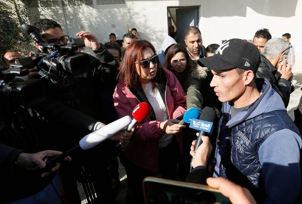 Walid, brother of suspect Anis Amri who is sought in relation with the truck attack on a Christmas market in Berlin, speaks to members of the media near their home in Oueslatia, Tunisia