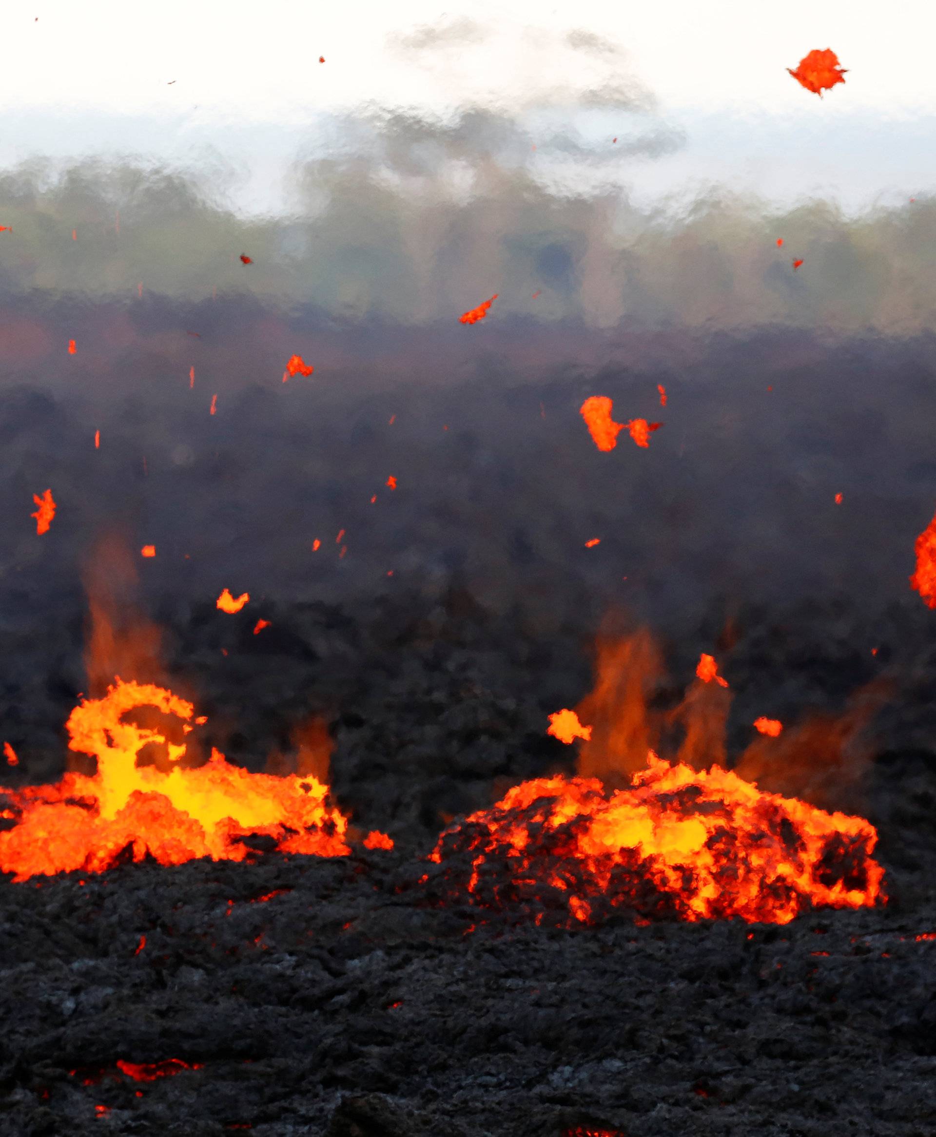 Lava erupts from a fissure on the outskirts of Pahoa