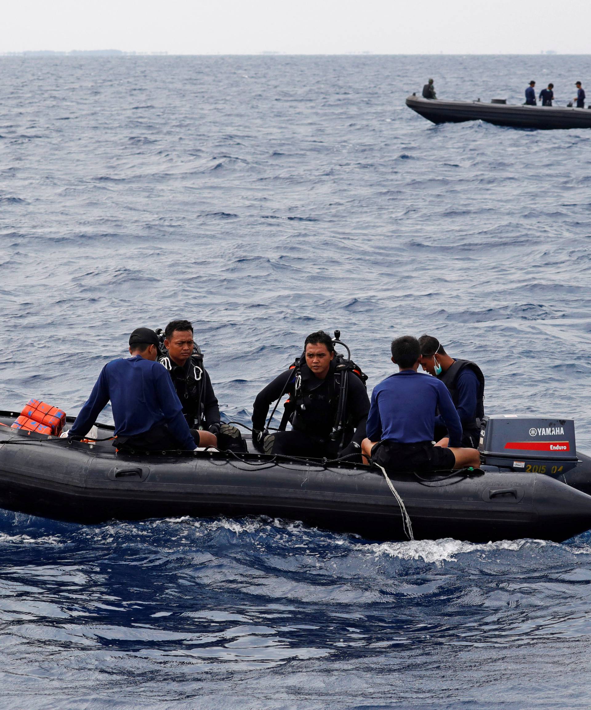 Rescue team members on inflatable rafts head to the location where Lion Air flight JT610 crashed into the sea, in the north coast of Karawang