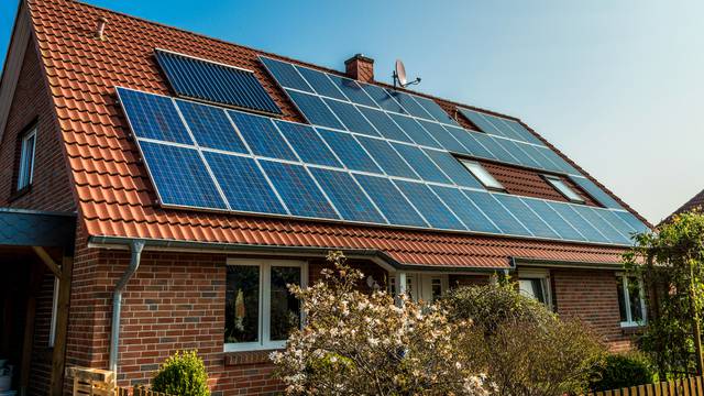 Solar,Panel,On,A,Red,Roof