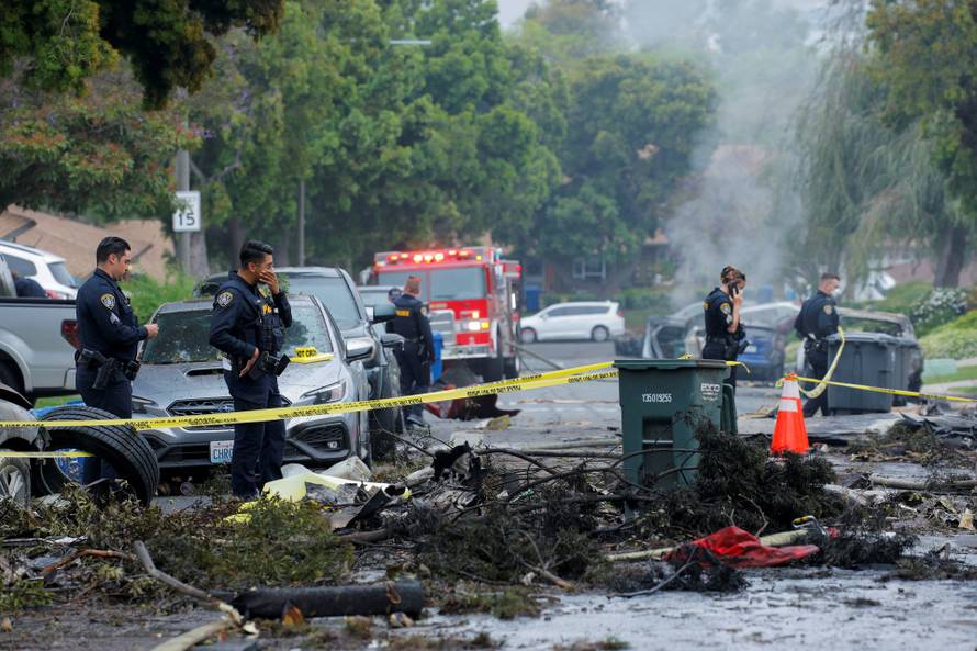 Crash scene after a civilian aircraft went down in a military neighborhood, in San Diego