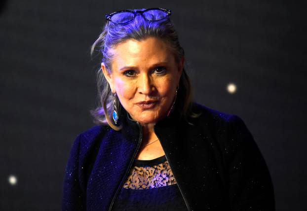 FILE PHOTO - Carrie Fisher poses for cameras as she arrives at the European Premiere of Star Wars, The Force Awakens in Leicester Square, London