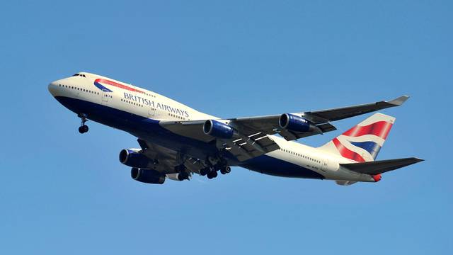 FILE PHOTO: A British Airways Boeing 747 flies into Heathrow Airport in west London