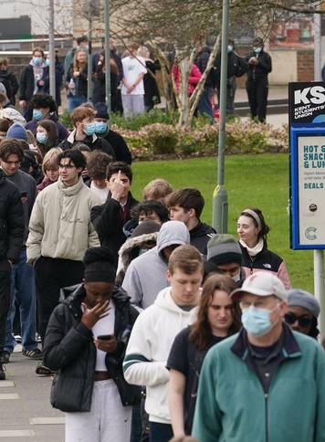 Students queuing for antibiotics outside a building at the University of Kent in Canterbury. The university have confirmed that a student was one of two people who have died as a result of meningitis in the area. The UK Health Security Agency (UKHSA) said