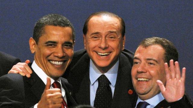 FILE PHOTO: Obama laughs with Berlusconi and Medvedev as they pose for a photograph at the G20 summit at the ExCel centre, in east London
