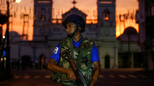 A security officer stands guard outside St. Antony's Shrine in Colombo