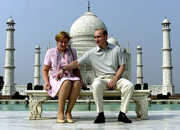 FILE PHOTO: Putin and his wife Lyudmila sit in front of the Taj Mahal while touring Agra