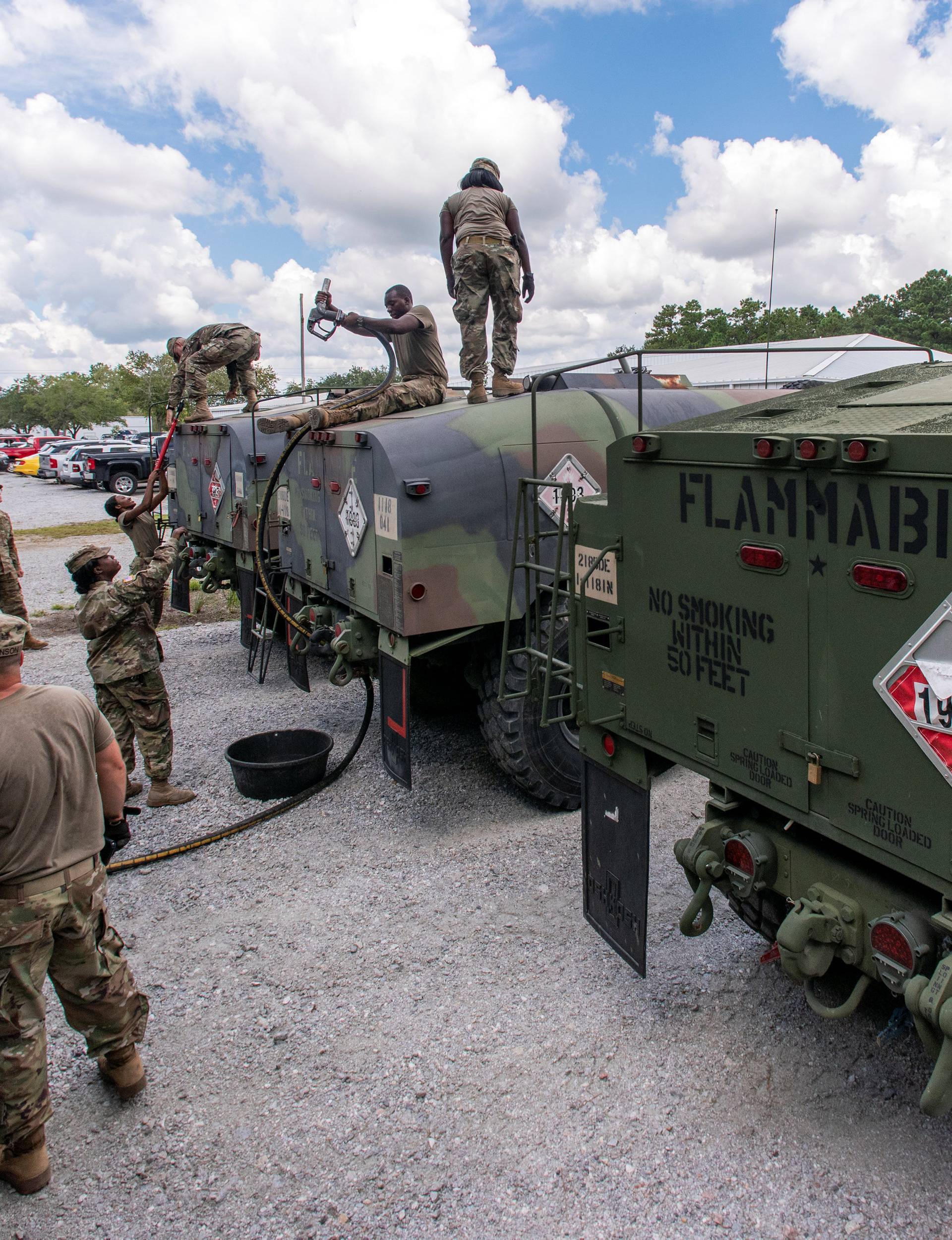 South Carolina National Guard soldiers transfer bulk diesel fuel into fuel tanker trucks for distribution in advance of Hurricane Florence