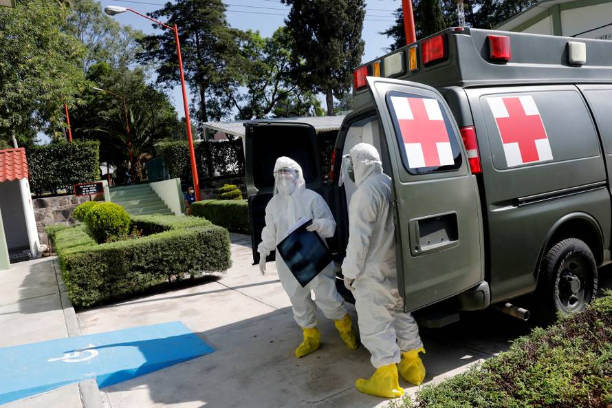 A paramedic holds a radiography plate outside the provisional military hospital Campo Militar No. 1, which takes care of patients with symptoms of the coronavirus disease (COVID-19) in Mexico City