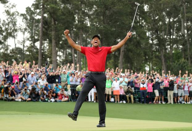 FILE PHOTO: Tiger Woods of the U.S. celebrates on the 18th hole to win the 2019 Masters