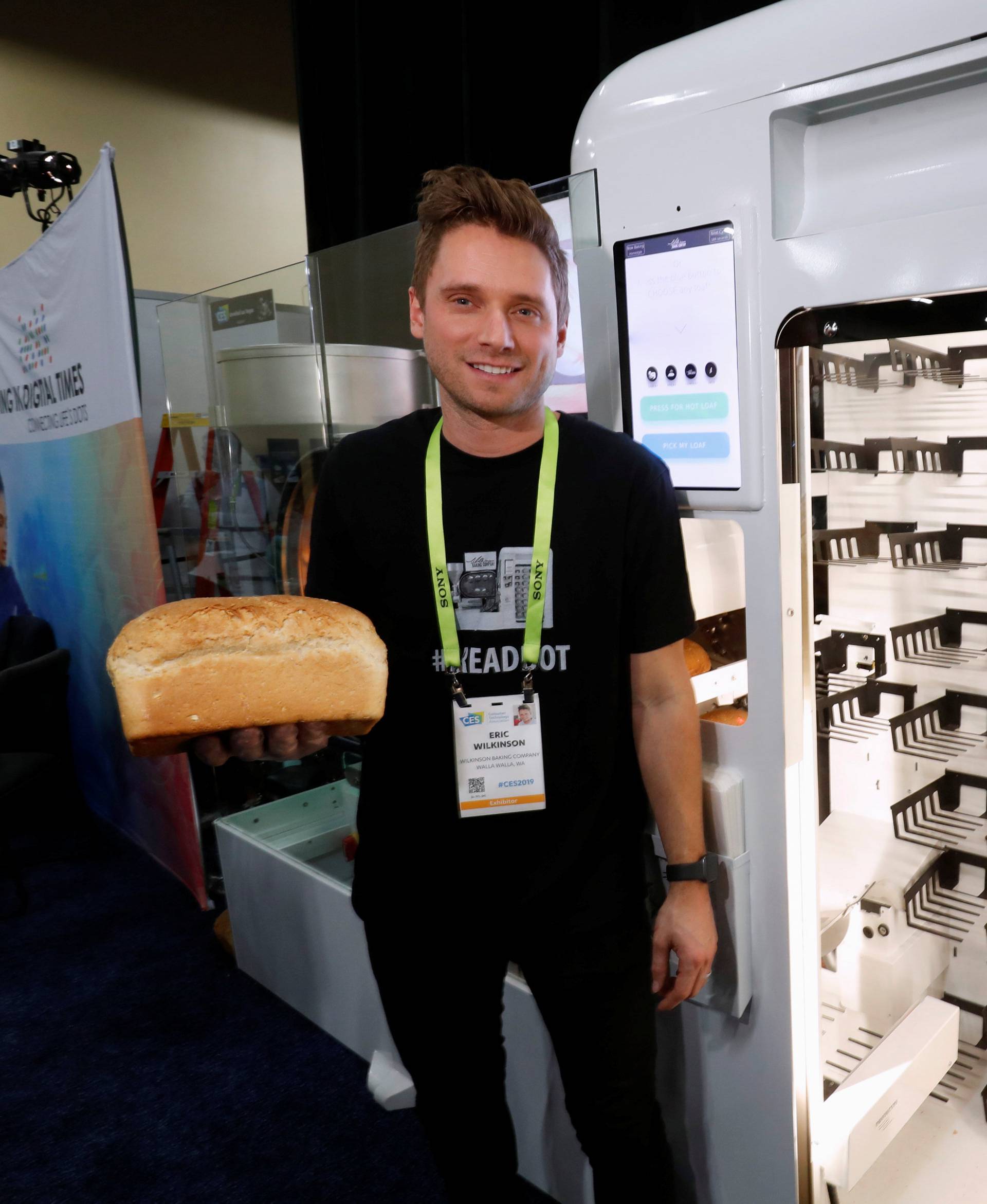 Eric Wilkinson stands by the Wilkinson Baking Company Breadbot, a self-contained, automated bakery, at "CES Unveiled" during the 2019 CES in Las Vegas