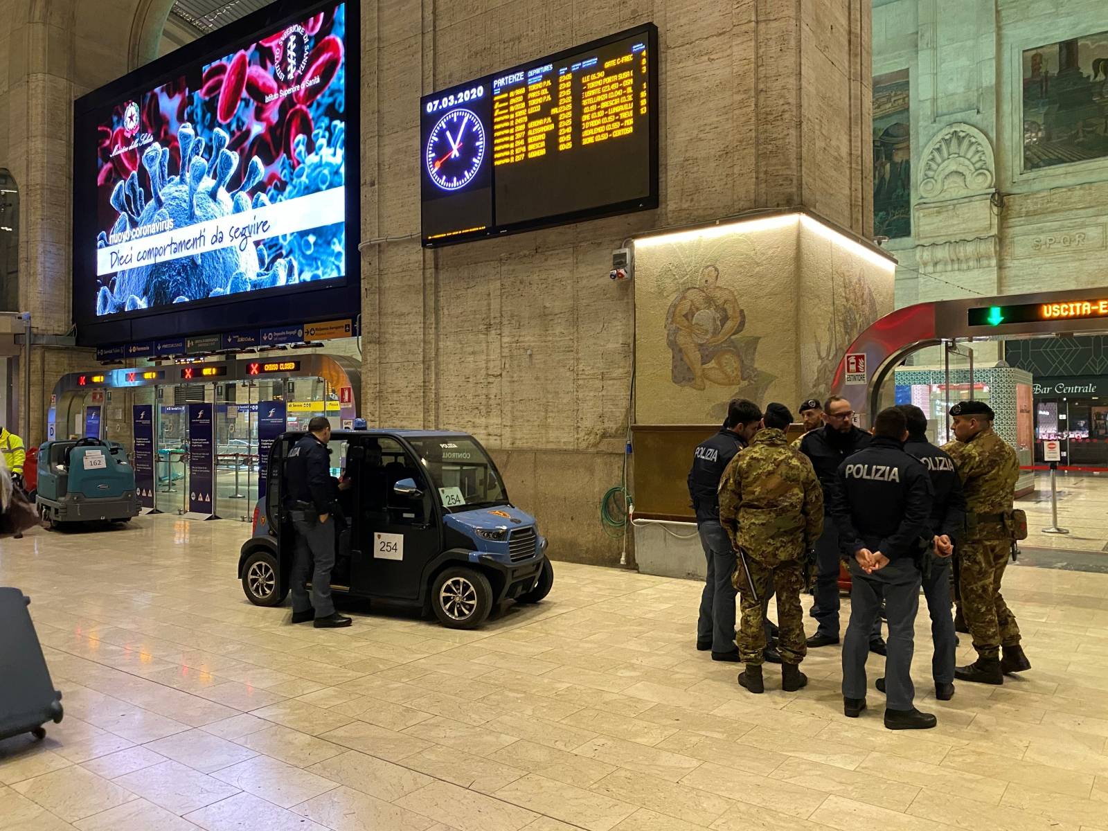 Military and policemen are seen inside Milan's main train station as Italian authorities prepare to lock down Lombardy to prevent the spread of the highly infectious coronavirus in Milan,