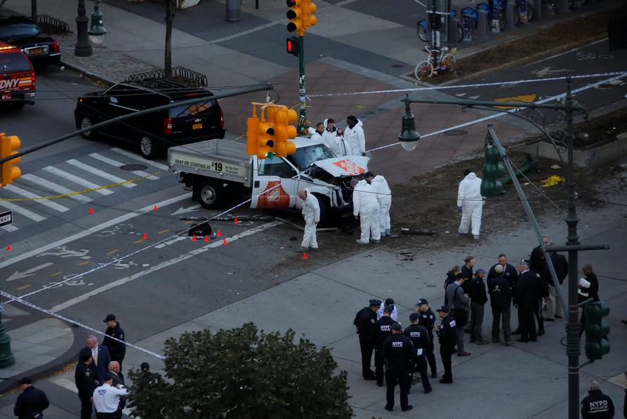 Police investigate a vehicle allegedly used in a ramming incident on the West Side Highway in Manhattan, New York.