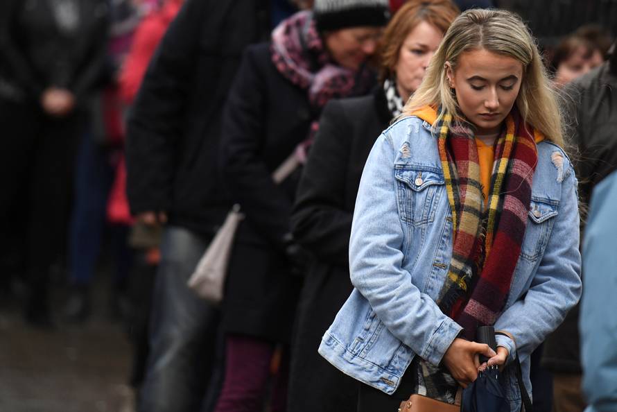 Members of the public queue to see Cranberries singer Dolores O'Riordan's coffin as it is carried into St. Joseph's Church for a public reposal in Limerick