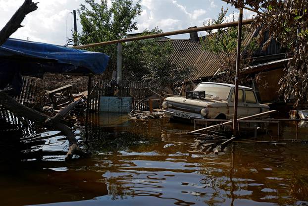 A view shows a Soviet-made Zaporozhets car in a street after floodwaters receded in Hola Prystan