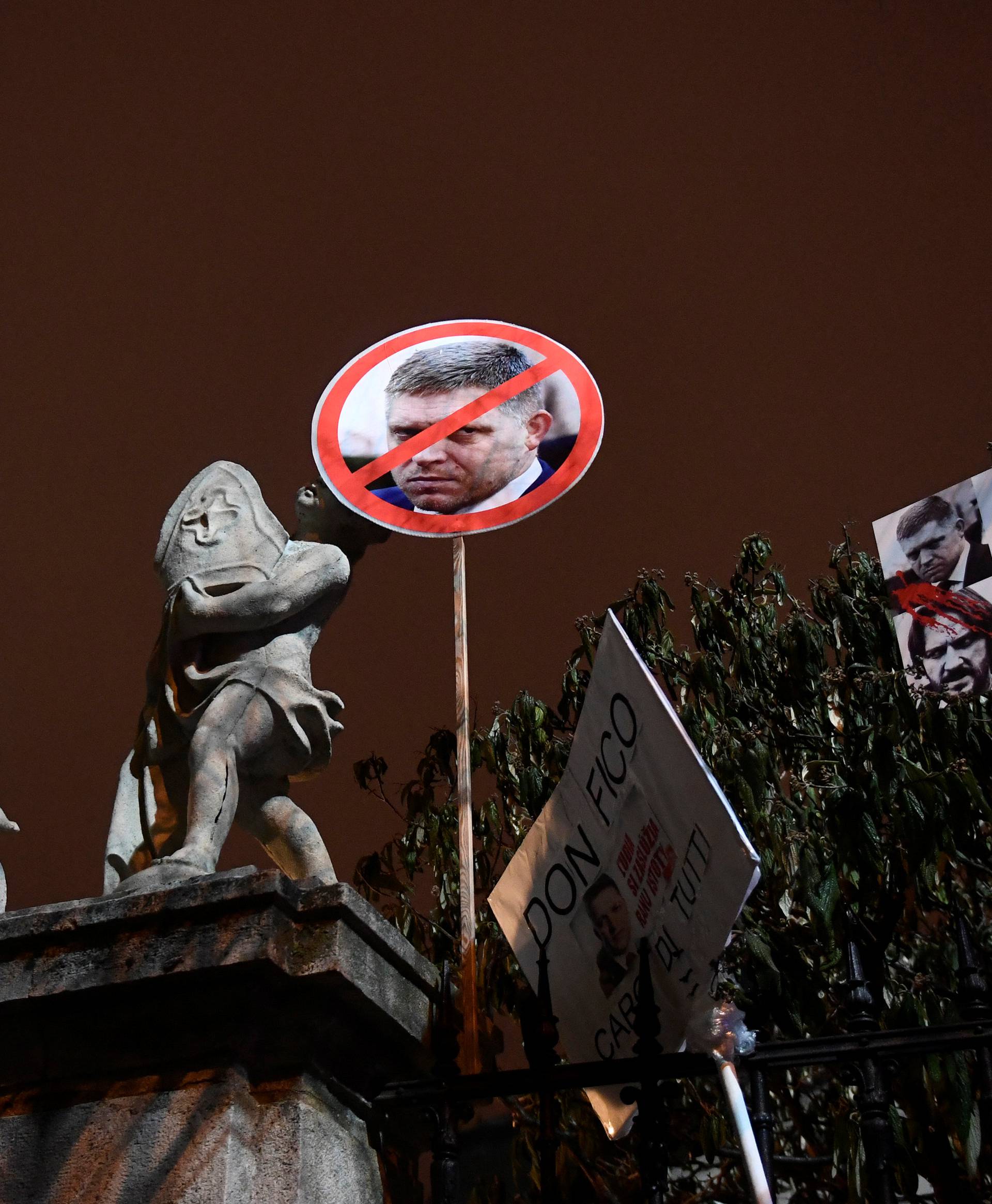 Banners with portrait of Slovakia's PM Fico are seen during a march in honour of murdered Slovak investigative reporter Jan Kuciak