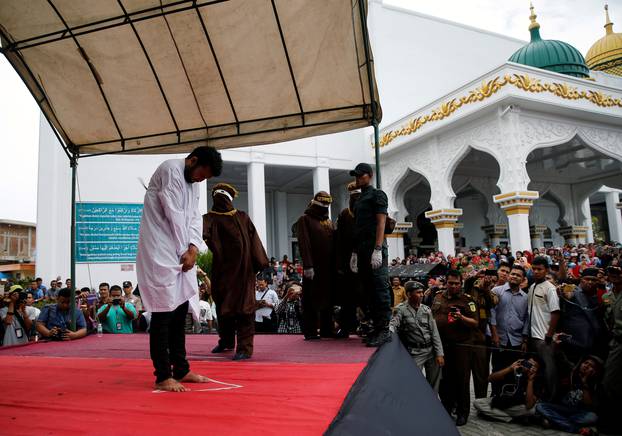 An Indonesian man is publicly caned for having gay sex, in Banda Aceh