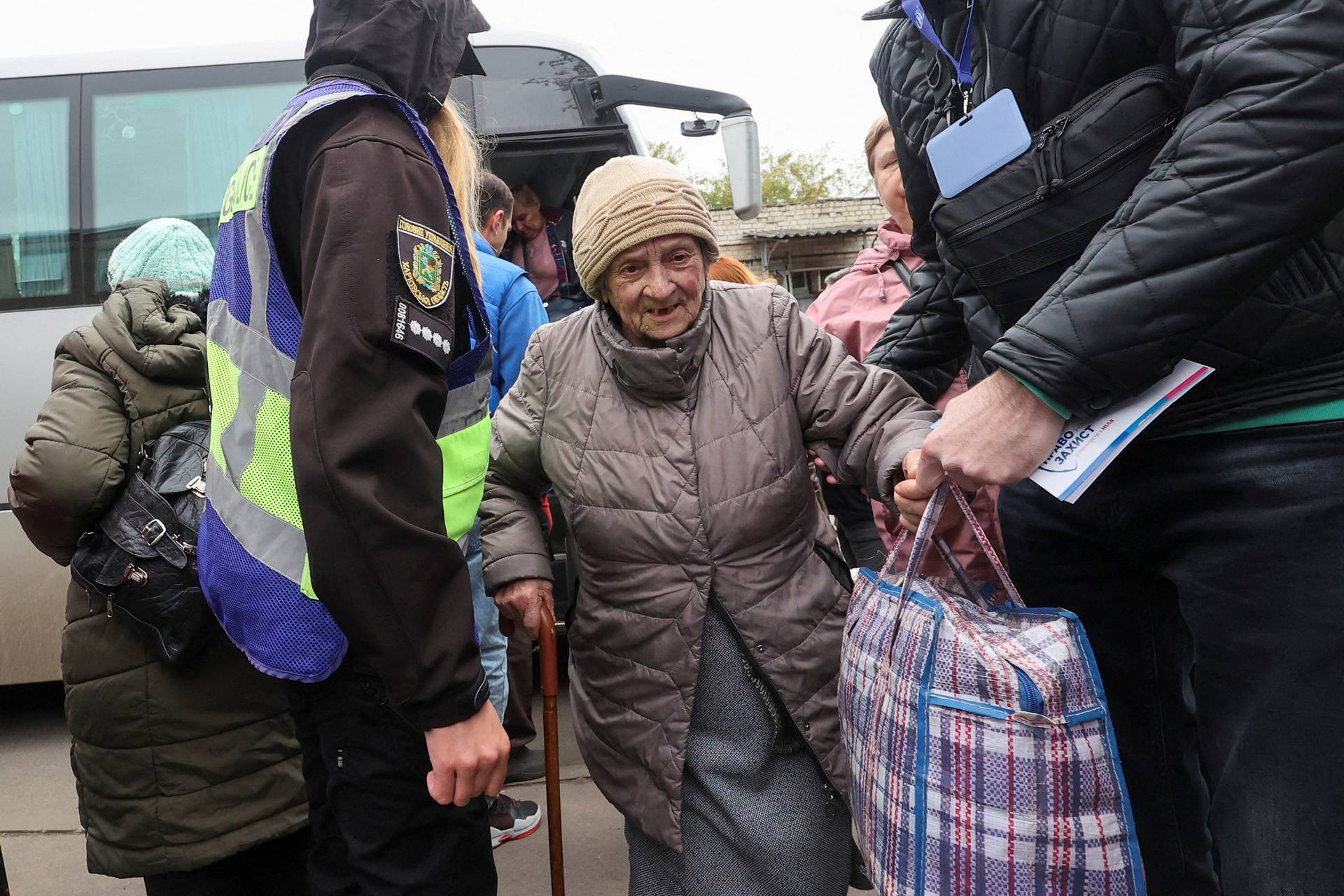 Kupiansk residents, who fled due to Russian military strikes, arrive to an evacuation centre in Kharkiv