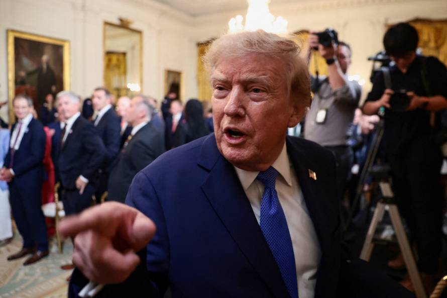U.S. President Donald Trump participates in a Team USA reception in the East Room at the White House