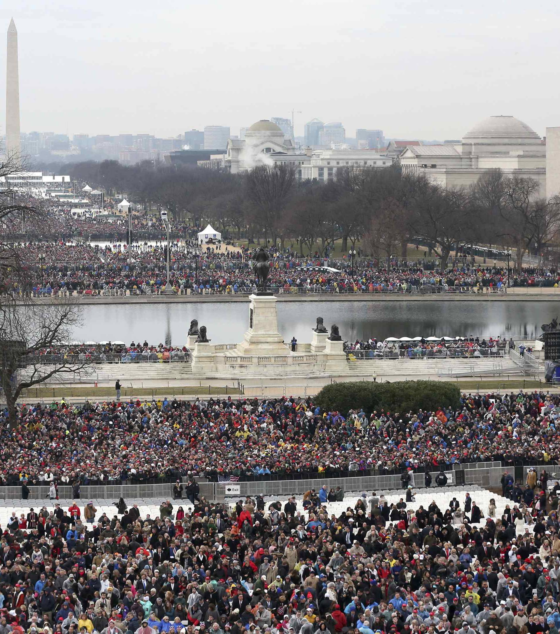 Spectators await the inauguration ceremonies swearing in Donald Trump as the 45th president of the United States on the West front of the U.S. Capitol in Washington