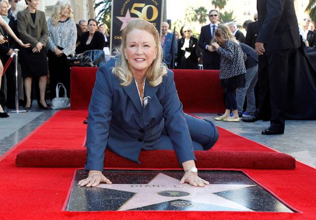 FILE PHOTO: Ladd touches her star on the Walk of Fame in Hollywood