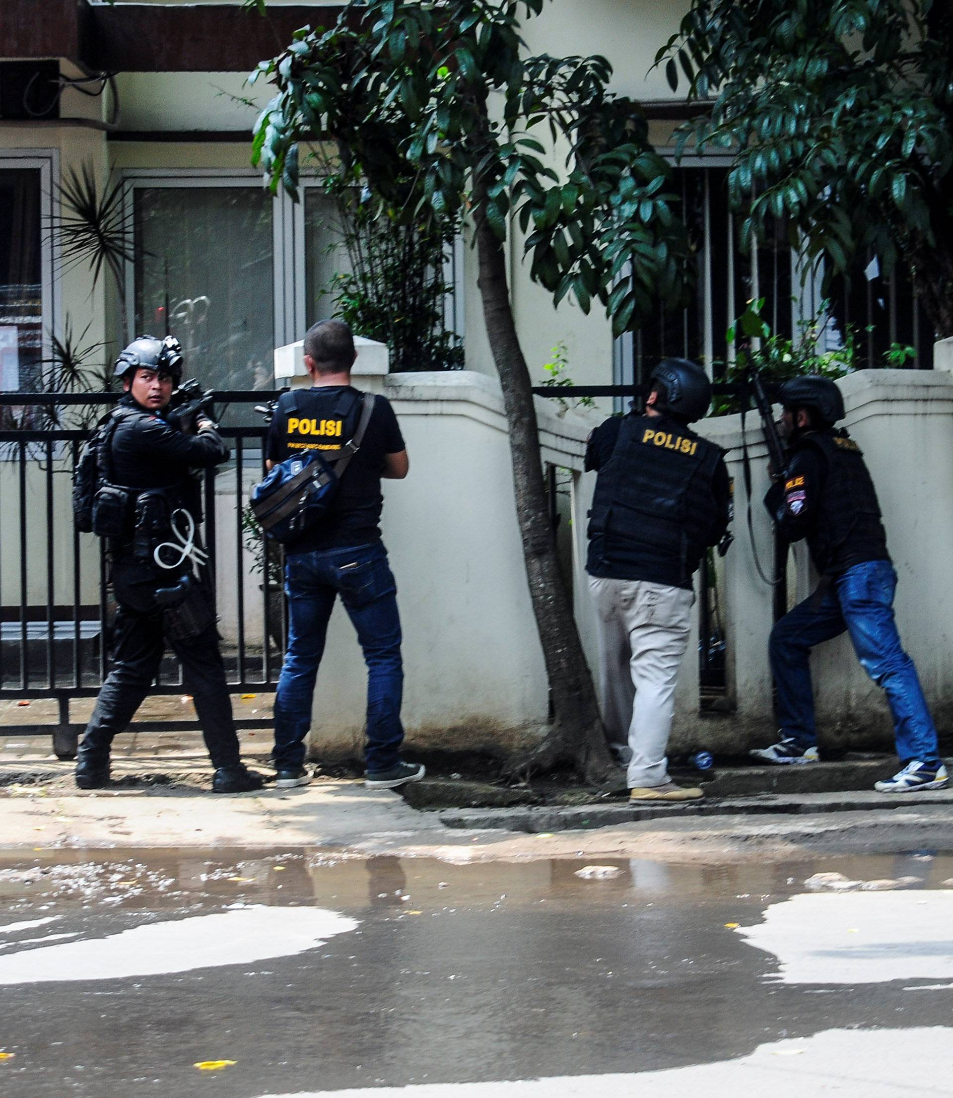 Police are seen near a local government office following an explosion in Bandung, West Java, Indonesia