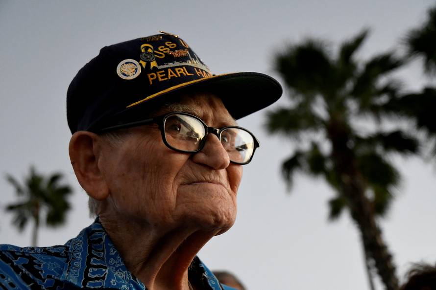 Pearl Harbor survivor Bill Hughes, who was aboard the USS Utah when it was attacked, arrives at a ceremony honoring the sailors of the USS Utah at the memorial on Ford Island at Pearl Harbor in Honolulu, Hawaii