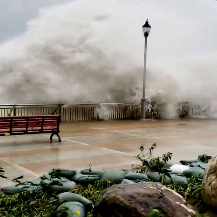 Waves spilling over a sea barriers as Typhoon Mangkhut approaches Hong Kong