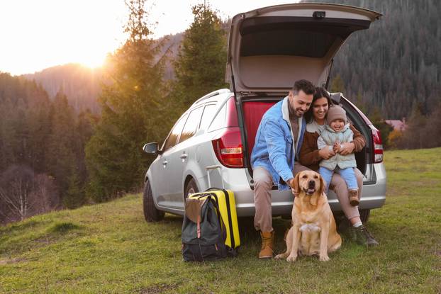 Parents,,Their,Daughter,And,Dog,Near,Car,In,Mountains,,Space