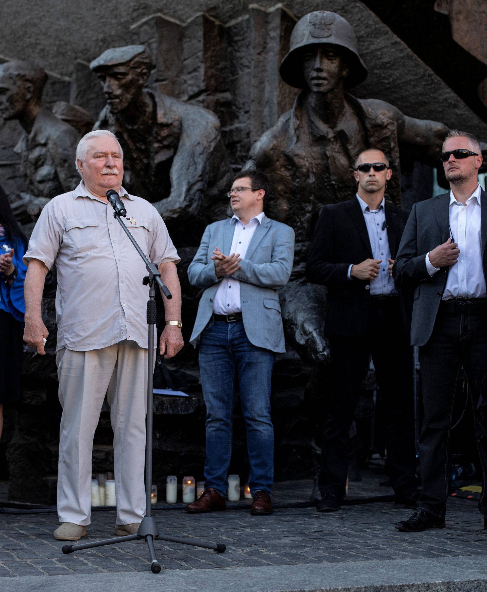 Former Polish President Lech Walesa speaks during a protest against the conservative government's makeover of the Polish judiciary in Warsaw