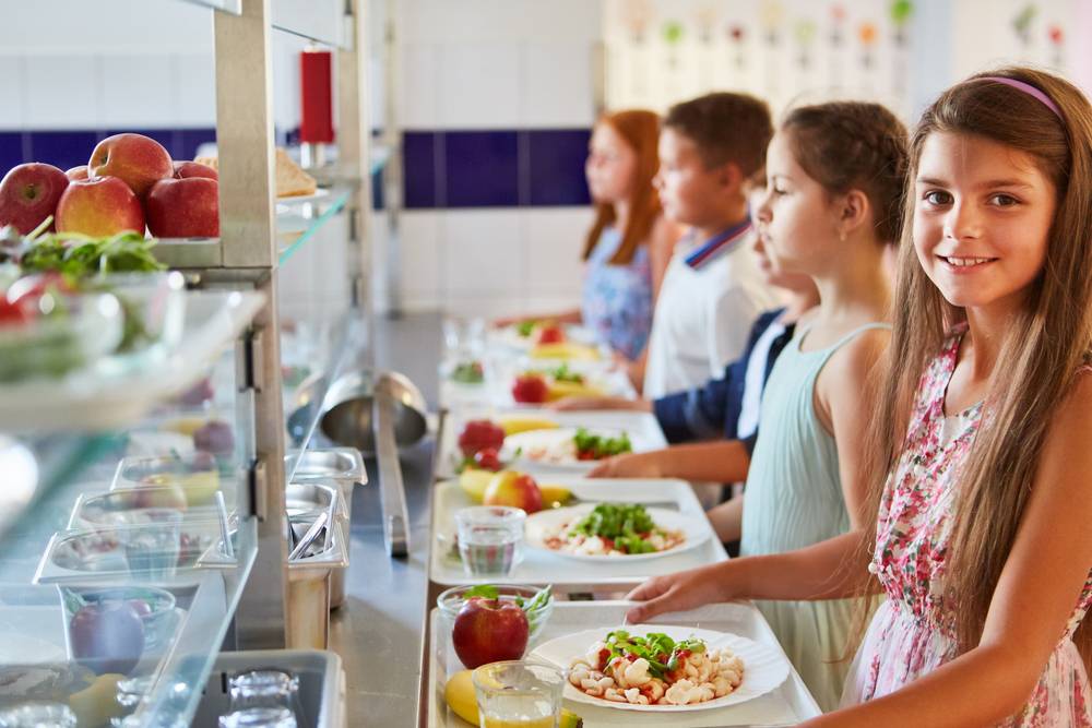 Portrait,Of,Smiling,Girl,With,Food,Tray,Standing,In,Line