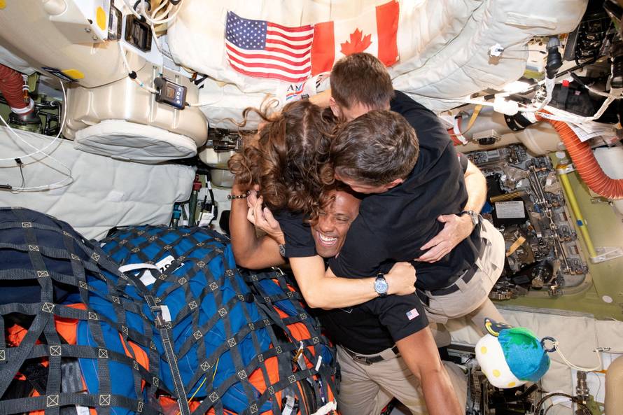 The NASA Artemis II crew embrace