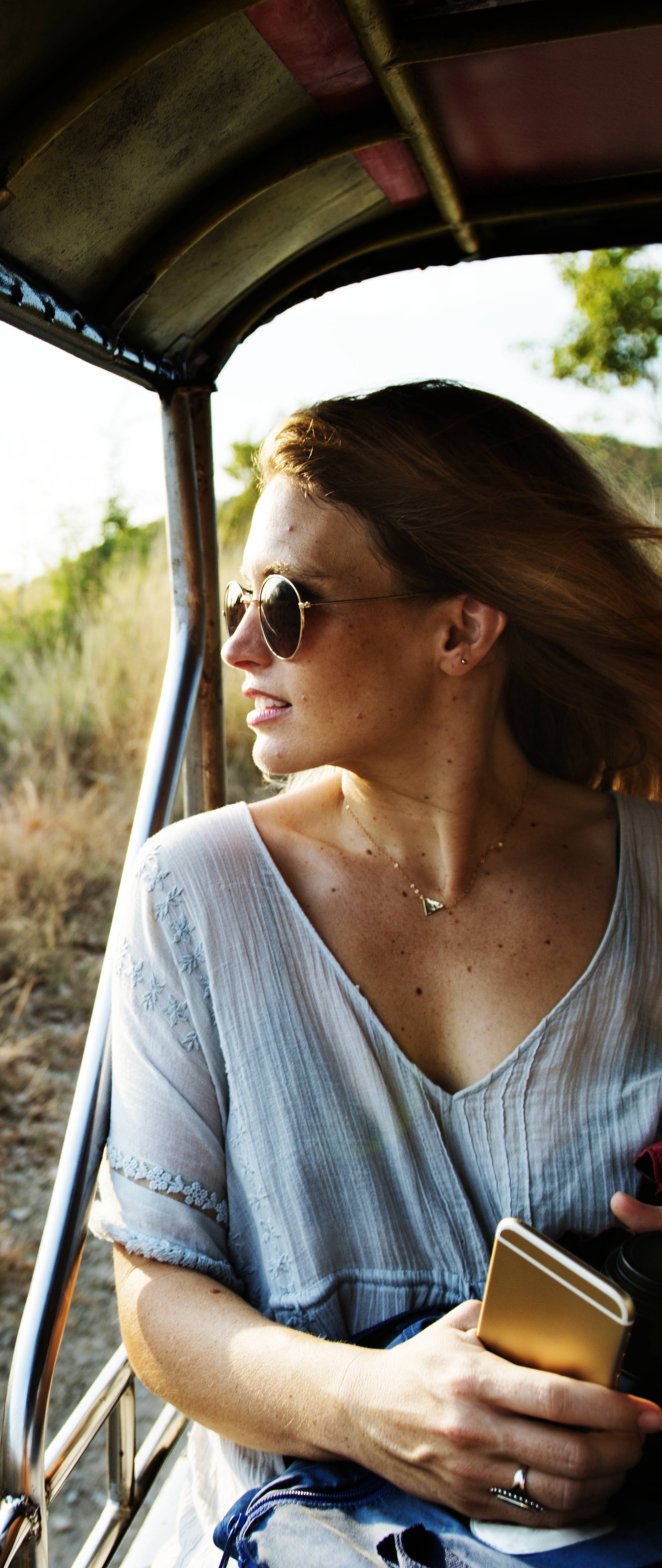 Young woman on the road trip to the nature