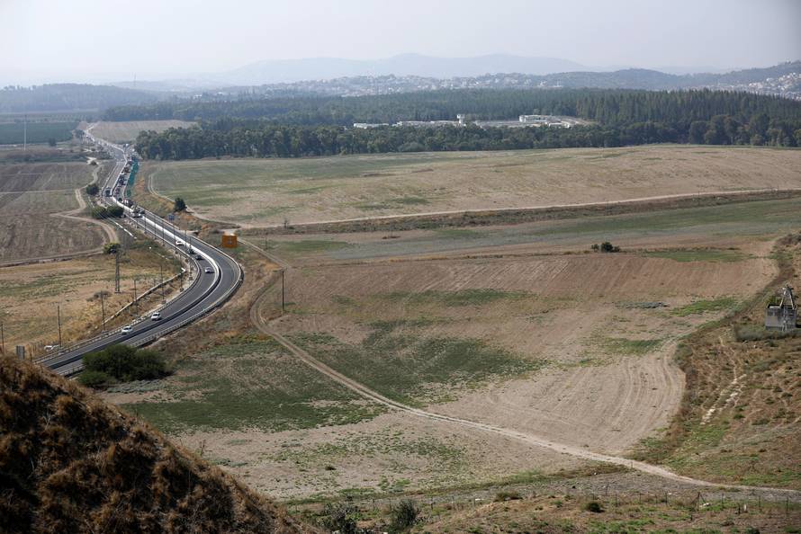 A view from the Tel Megiddo Archaeological site shows the Megiddo Prison Complex in the far background
