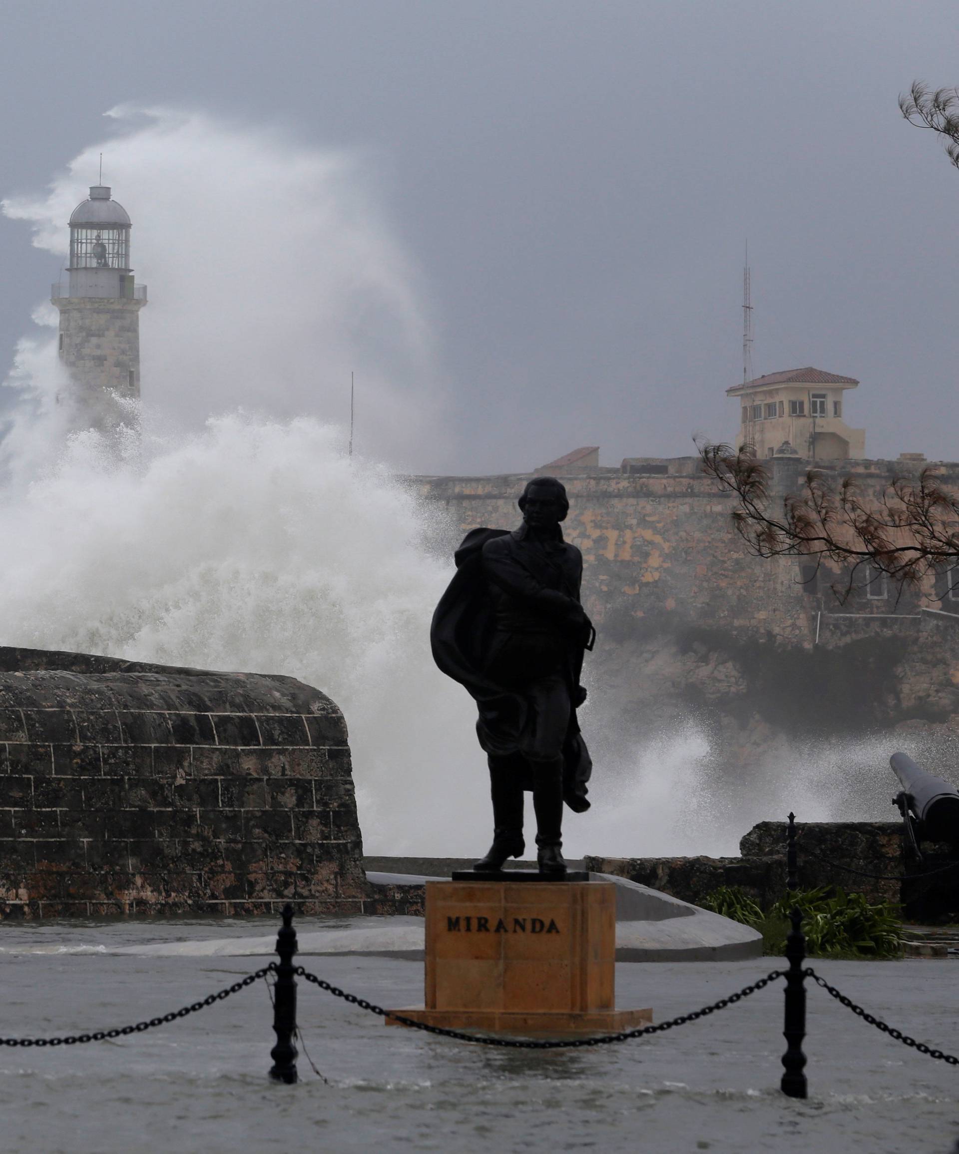 Waves crash against the lighthouse after the passing of Hurricane Irma, in Havana