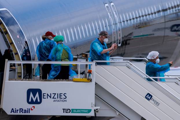 Passengers of the cruise ship MV Hondius, which was affected by a hantavirus outbreak, arrive at Tenerife Sud airport