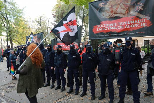 People protest against imposing further restrictions on abortion law in Poland in front of the Constitutional Court building in Warsaw