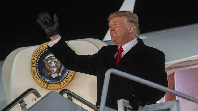 U.S. President Donald Trump waves upon arriving aboard Air Force One at W.K. Kellogg Airport in Battle Creek, Michigan